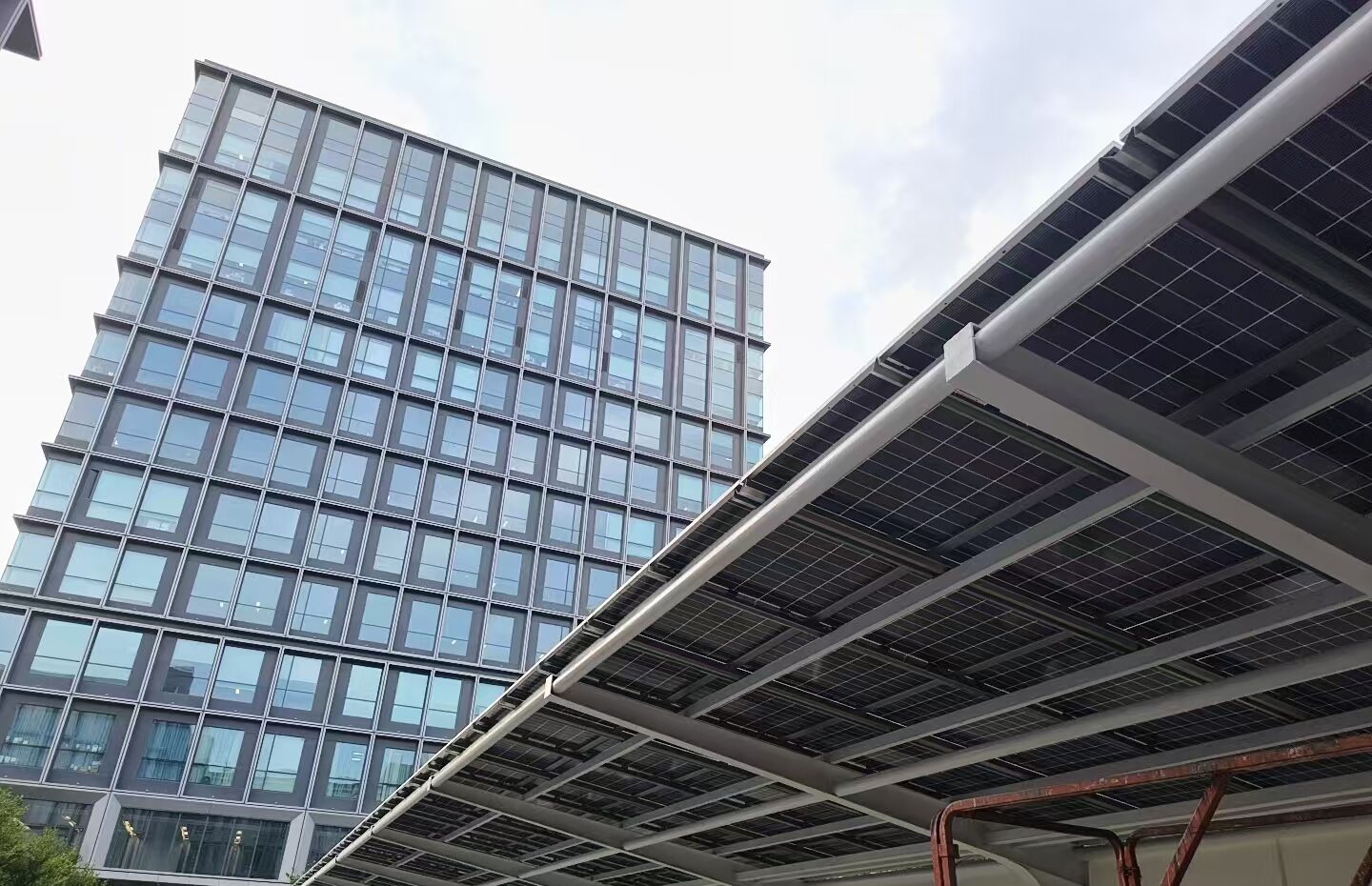 Solar carport beside an office tower at China Construction Enterprise Plaza, Qingpu